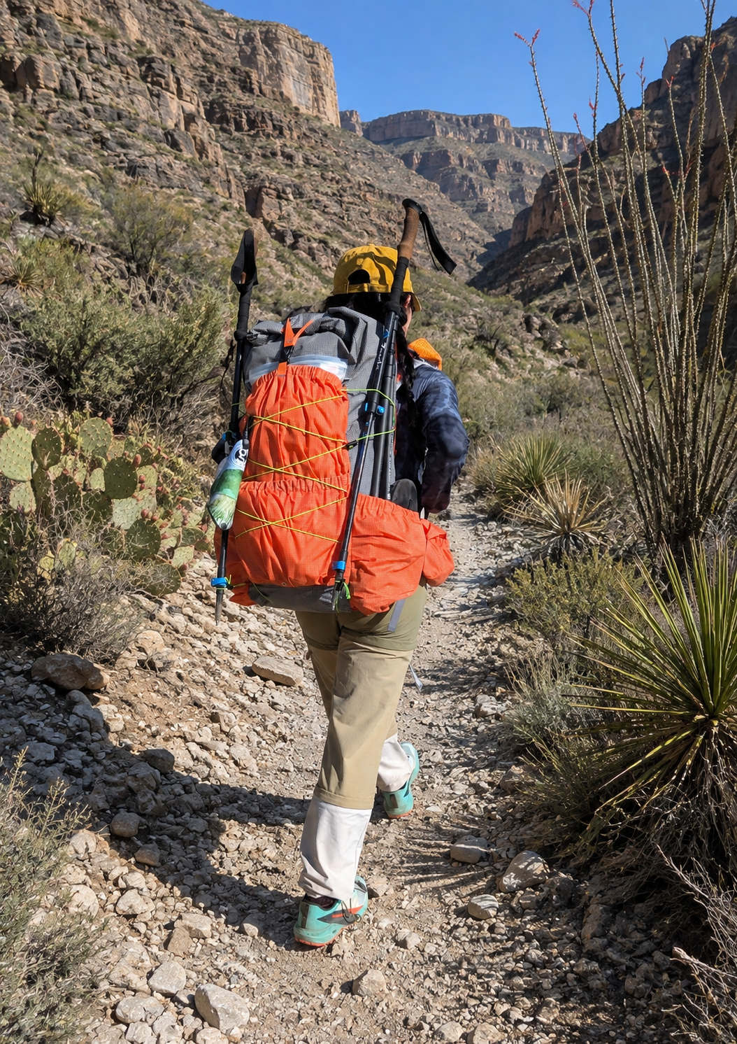 Woman hiking with the Resolute 50-55 backpack.